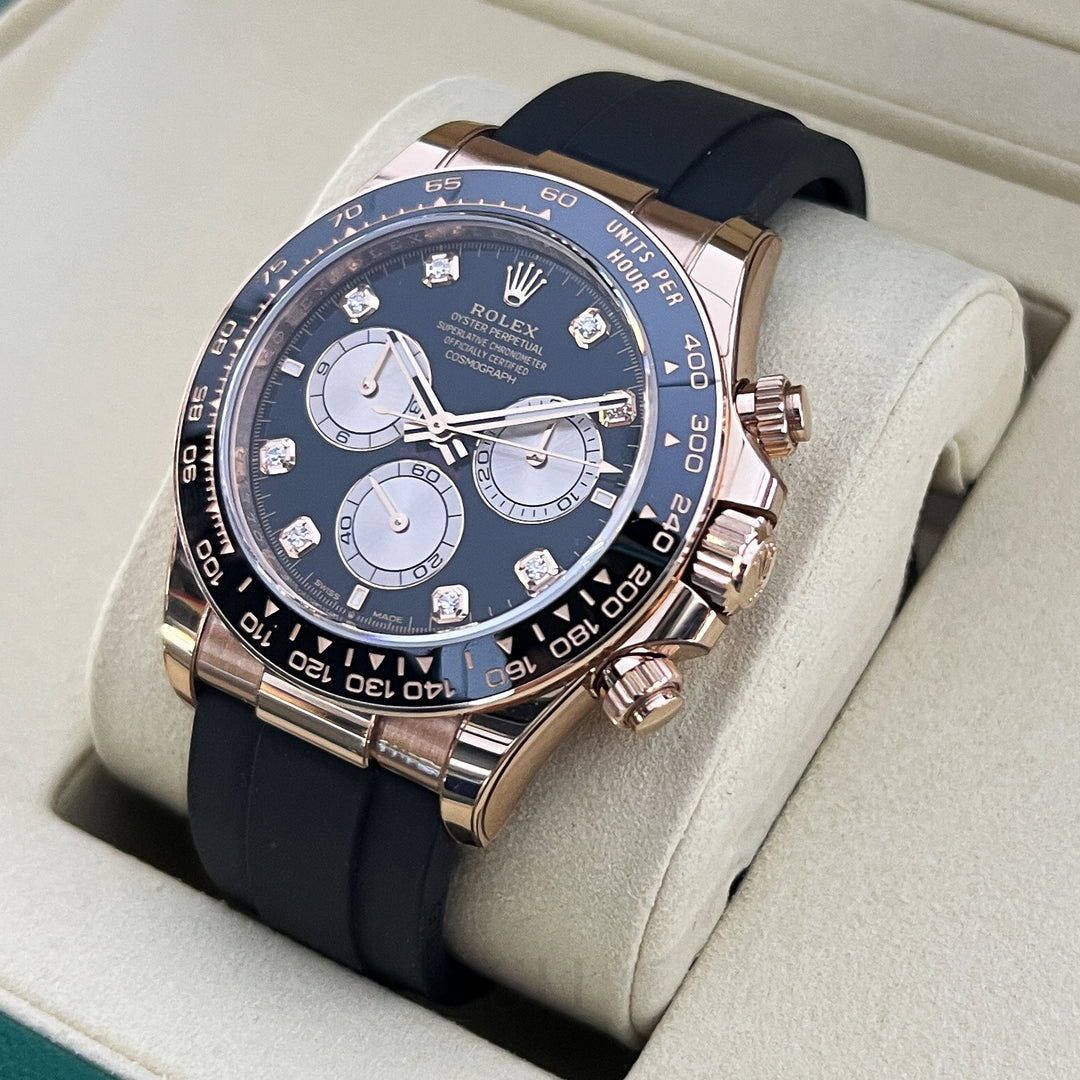 Luxury watch with blue dial and black strap in a display case